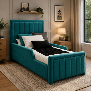 A teal velvet single bed frame with a tall tufted headboard and matching footboard, styled in a modern bedroom with white and black bedding, wooden nightstands, and a beige rug.