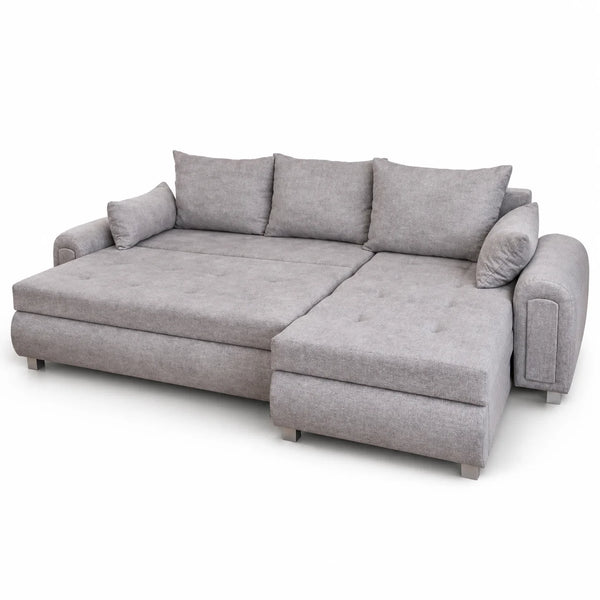 A light gray fabric sectional sofa with a chaise lounge on the right side, three matching back cushions, and two loose throw pillows, shown on a plain white background.